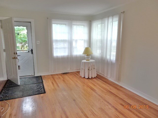 1805 Gilbert Avenue Downers Grove, IL 60515 - Photo 2 of 15 a view of empty room with wooden floor and fan