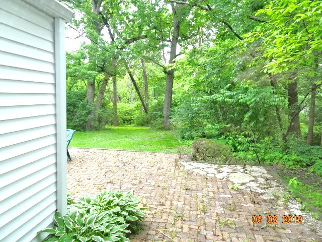1805 Gilbert Avenue Downers Grove, IL 60515 - Photo 11 of 15 a view of a garden with a bench