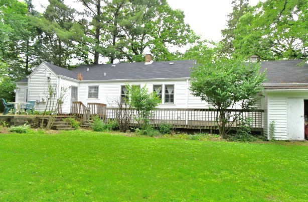 1805 Gilbert Avenue Downers Grove, IL 60515 - Photo 13 of 15 a front view of a house with a garden and yard