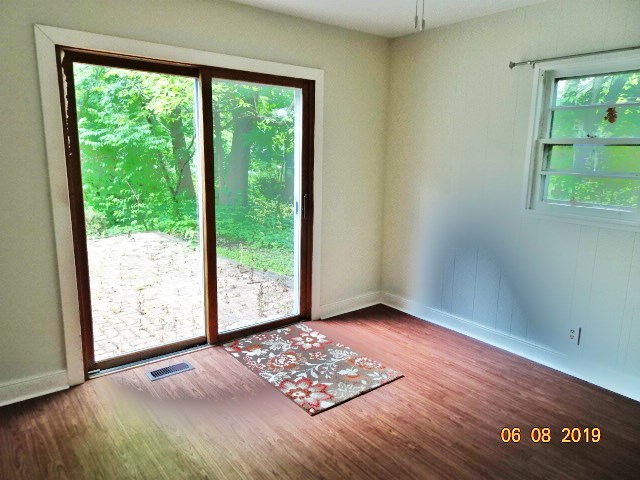 1805 Gilbert Avenue Downers Grove, IL 60515 - Photo 9 of 15 a view of an empty room with wooden floor and a window