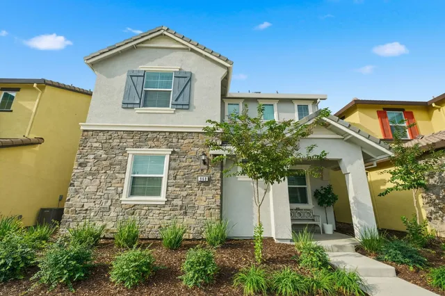 front view of a house with a yard