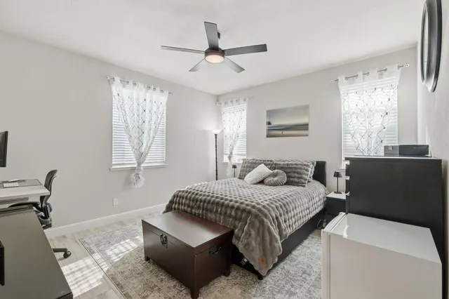 a bedroom with a bed and window