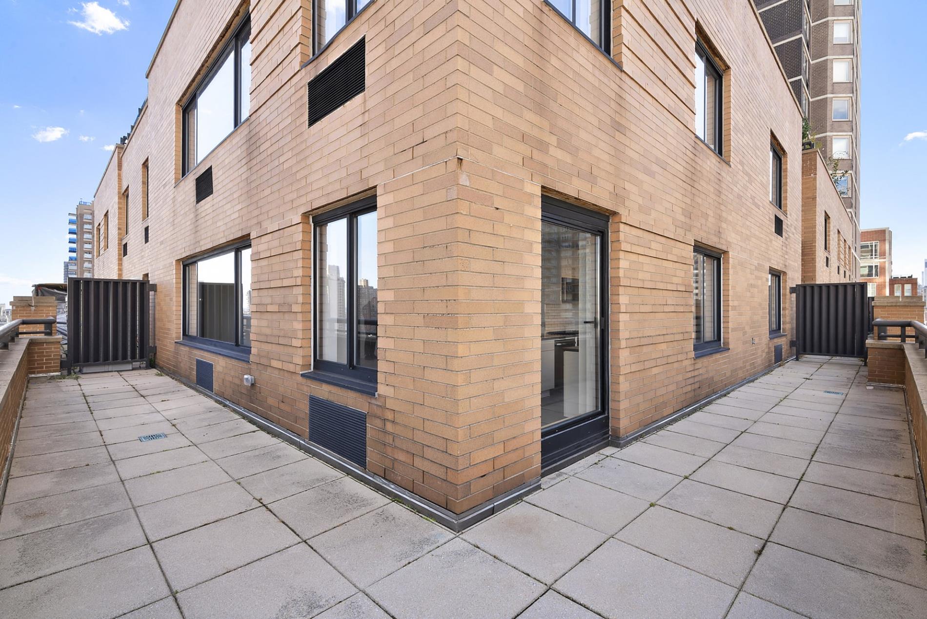 200 East 87th Street, Unit 17F Manhattan, NY 10028 - Photo 8 of 9 a view of a brick buildings with entryway doors