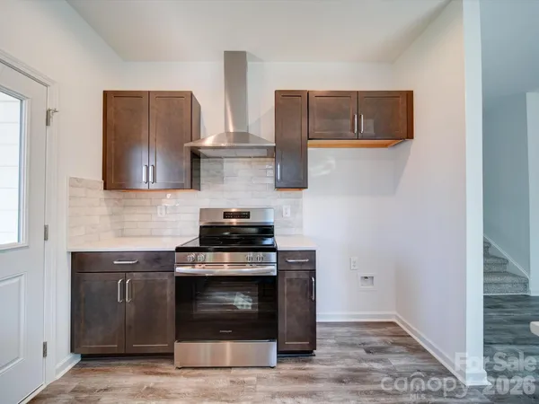 a kitchen with stainless steel appliances a stove and a refrigerator