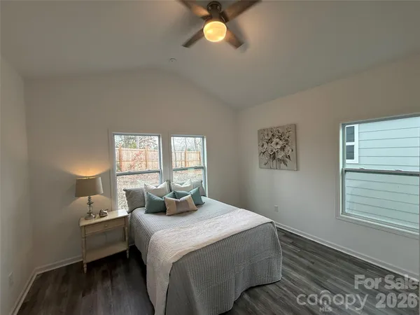 a bedroom with a bed and window