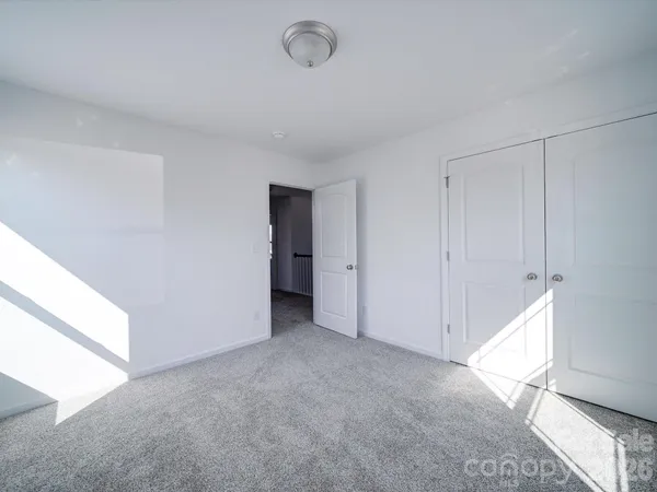 a bathroom with a sink vanity and a toilet