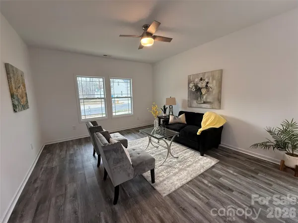 a living room with furniture and window