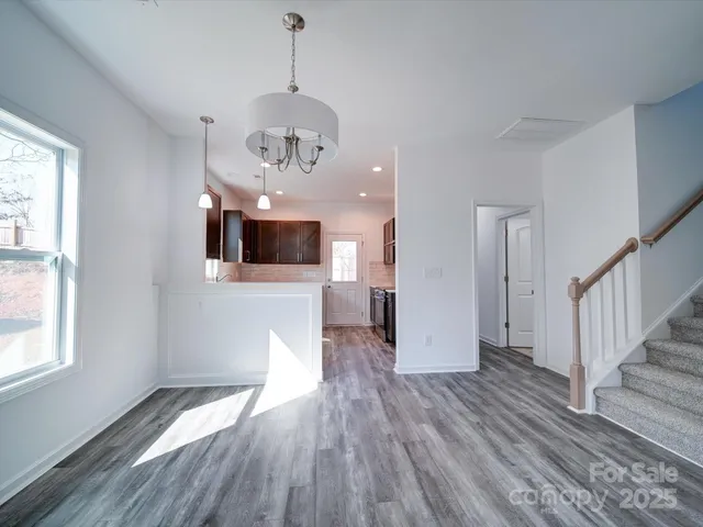 a kitchen with a sink stove top oven and refrigerator