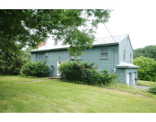 44 Chestnut Hill Road Groton, MA 01450 - Photo 1 of 23 a view of a house with a yard