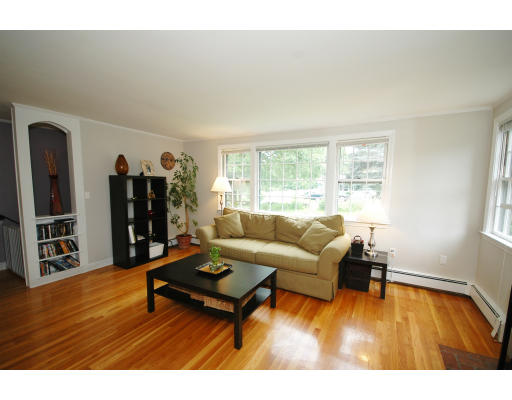 44 Chestnut Hill Road Groton, MA 01450 - Photo 11 of 23 a living room with furniture and a wooden floor