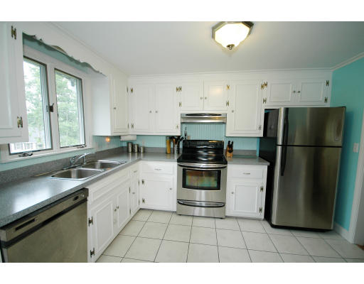 44 Chestnut Hill Road Groton, MA 01450 - Photo 15 of 23 a kitchen with a refrigerator and a sink