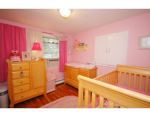 44 Chestnut Hill Road Groton, MA 01450 - Photo 18 of 23 a kitchen with a sink and wooden cabinets