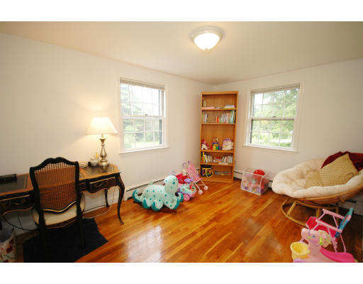 44 Chestnut Hill Road Groton, MA 01450 - Photo 19 of 23 a living room with furniture and a wooden floor