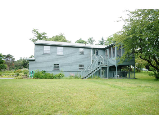 44 Chestnut Hill Road Groton, MA 01450 - Photo 6 of 23 a view of a house with a backyard