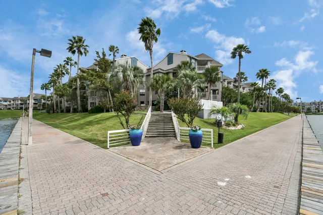 a picture of a living room with furniture and a kitchen