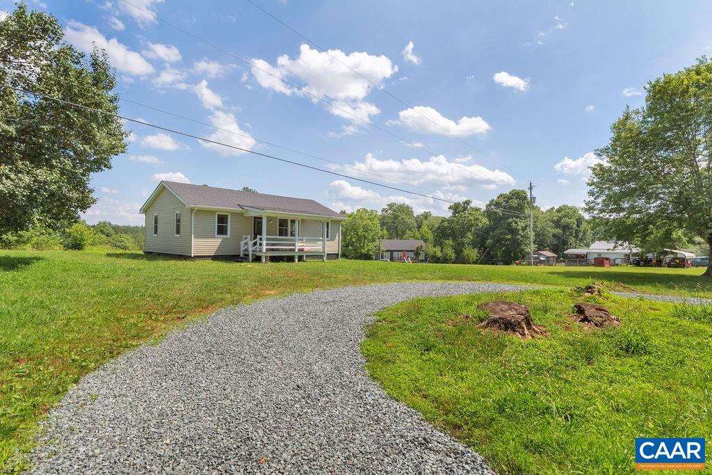 8087 Chestnut Grove Road Esmont, VA 22937 - Photo 4 of 36 a view of house with garden space and car parked