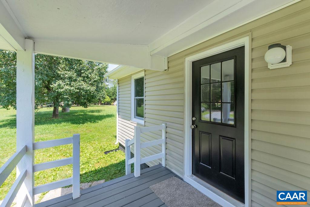 8087 Chestnut Grove Road Esmont, VA 22937 - Photo 5 of 36 a view of porch with a door and chair