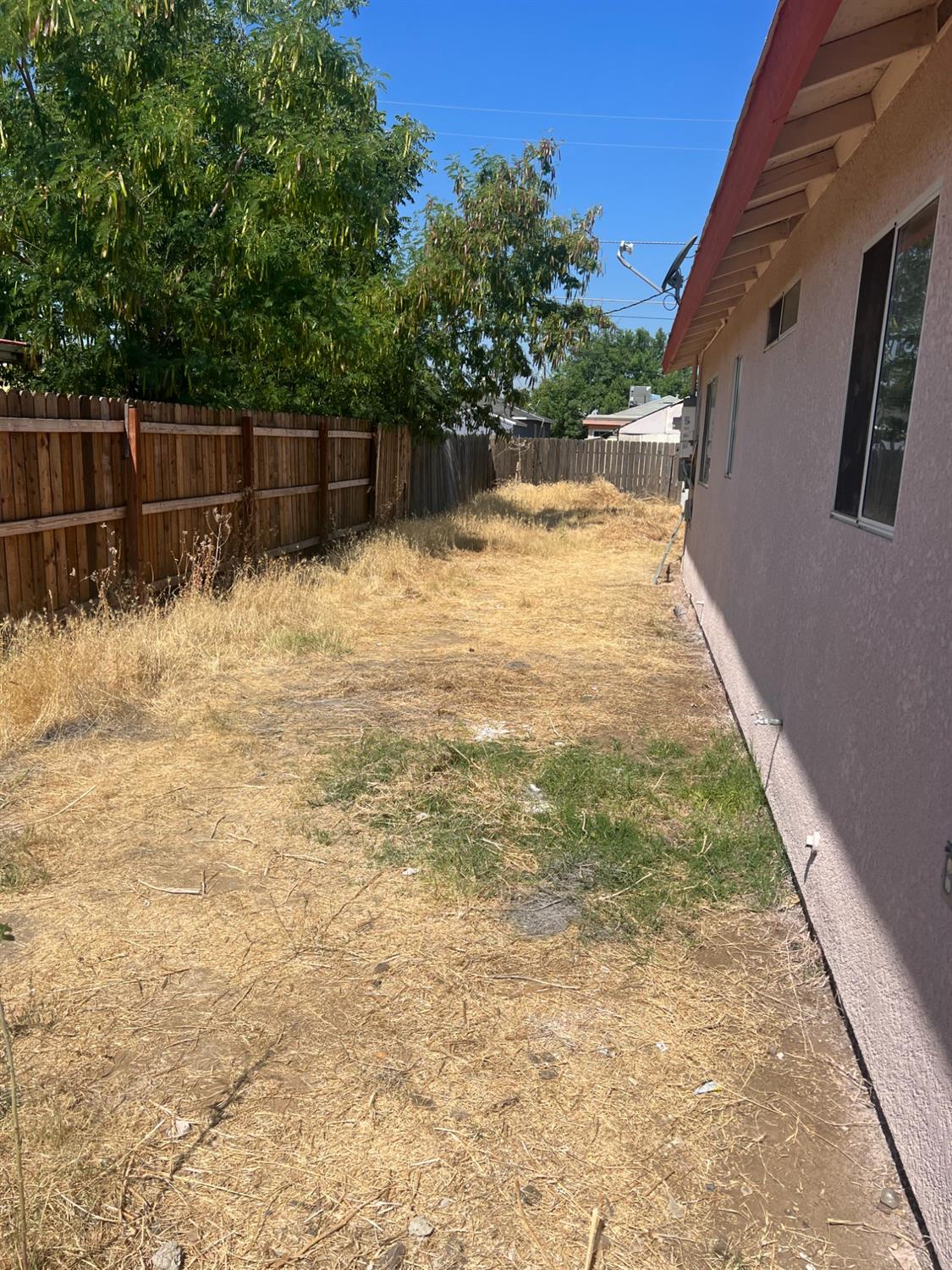 328 Hull Avenue Madera, CA 93638 - Photo 2 of 10 a backyard of a house with lots of green space