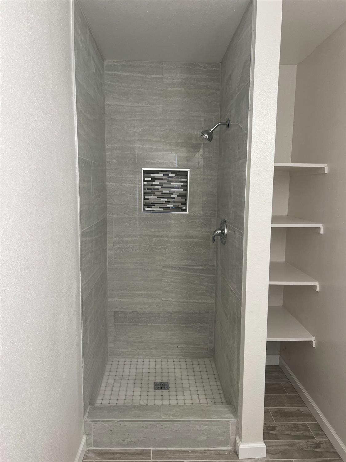 328 Hull Avenue Madera, CA 93638 - Photo 8 of 10 a bathroom with a shower