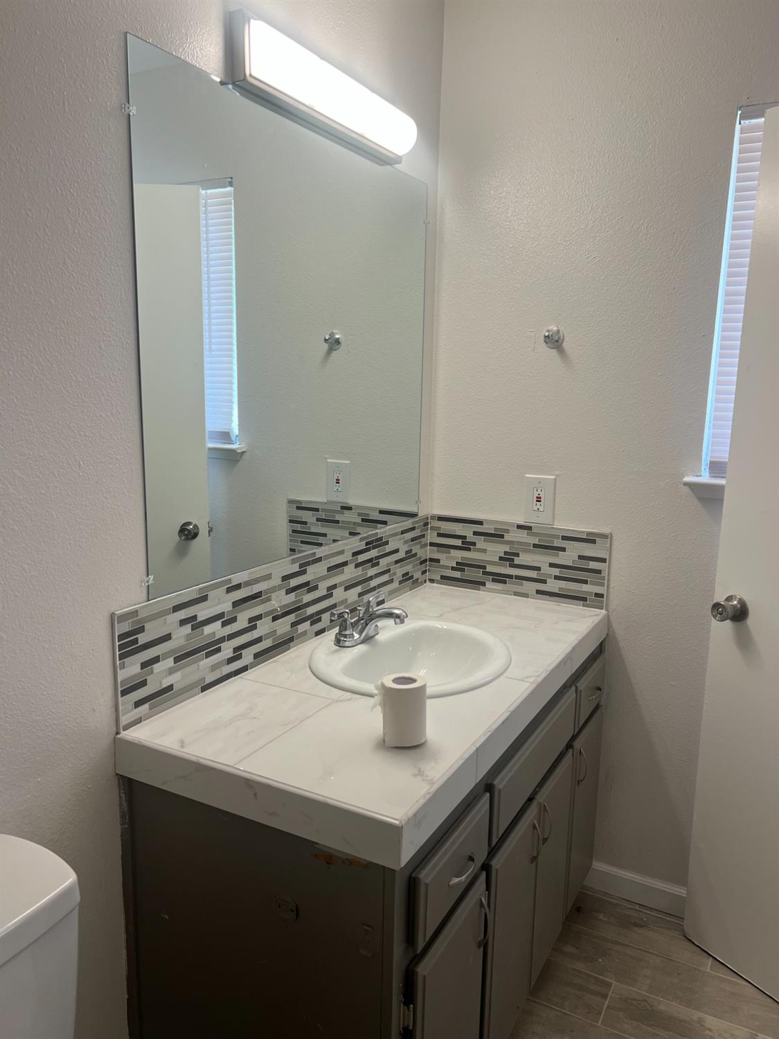 328 Hull Avenue Madera, CA 93638 - Photo 9 of 10 a bathroom with a sink and a mirror