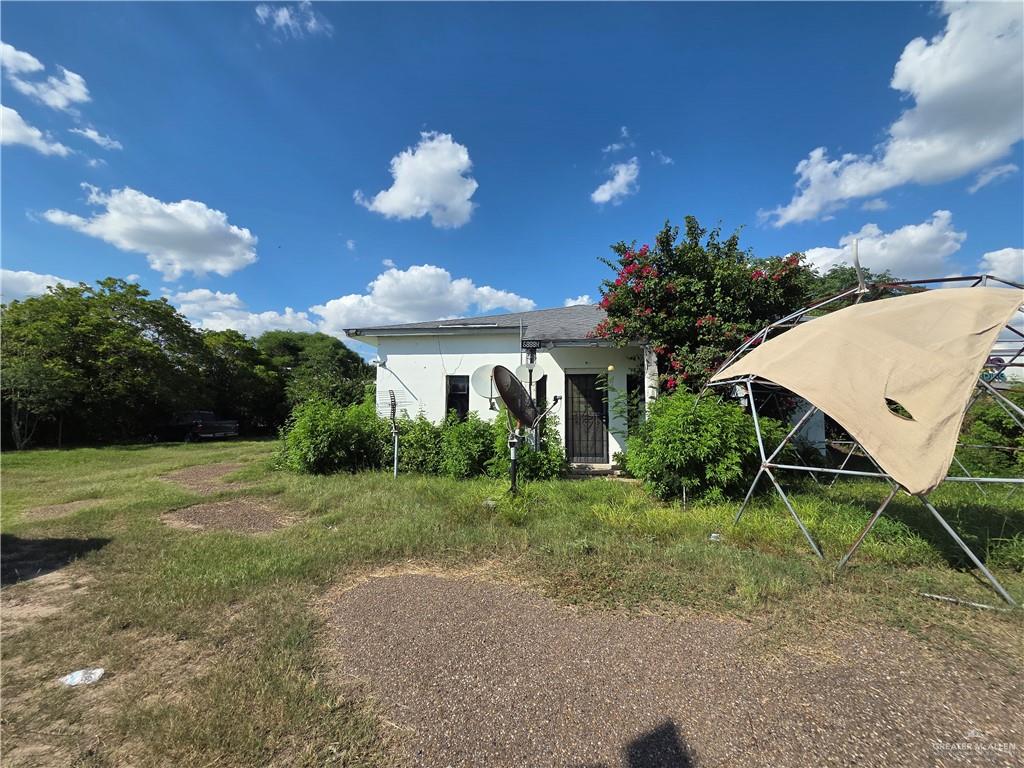 824 East Frontage Road Alamo, TX 78516 - Photo 5 of 6 a view of a house with a yard