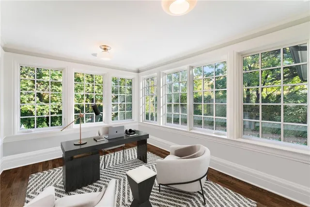 a living room with furniture and windows