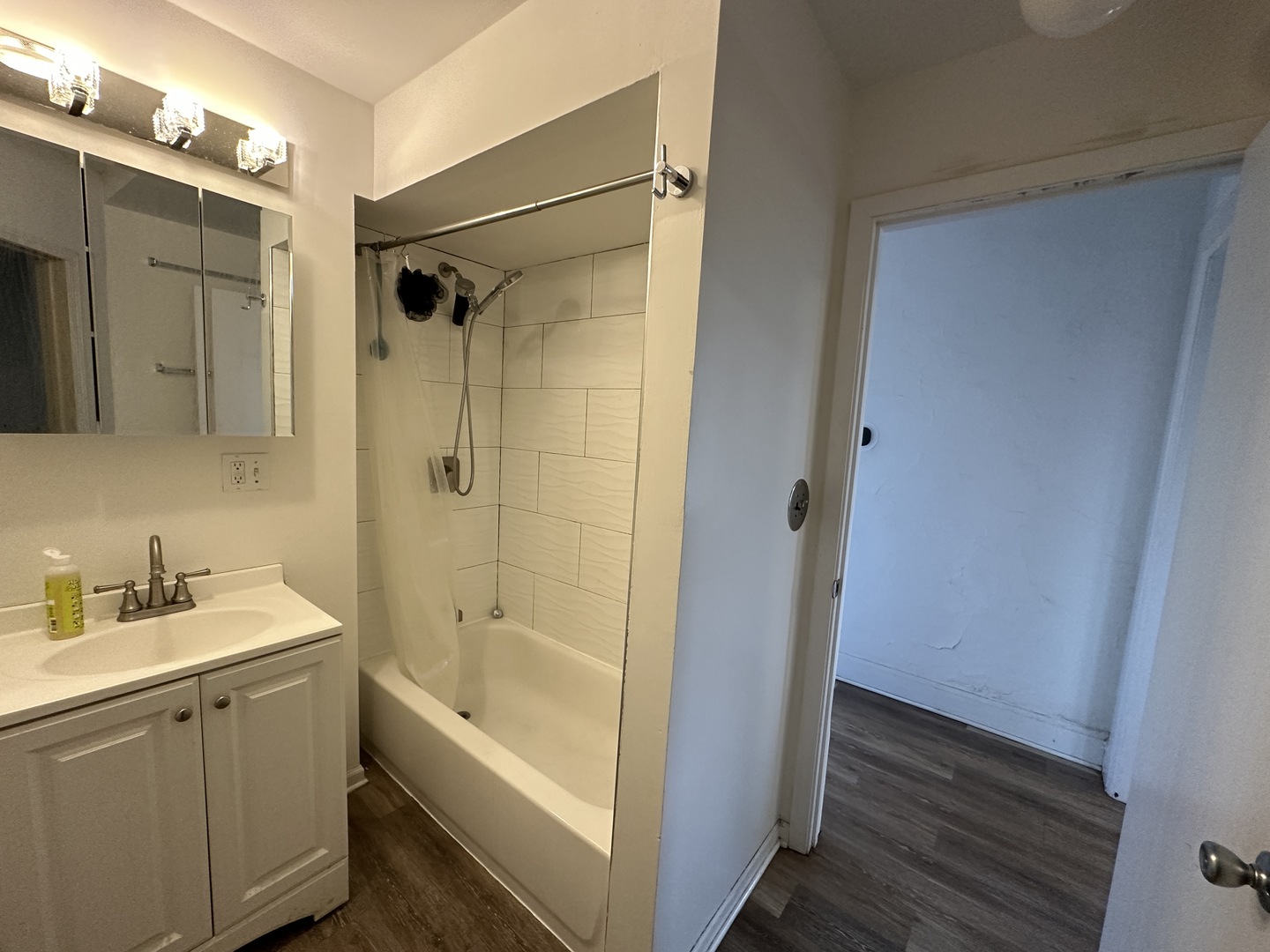 1237 North Noble Street, Unit 4 Chicago, IL 60642 - Photo 19 of 27 a bathroom with a tub shower vanity and a sink