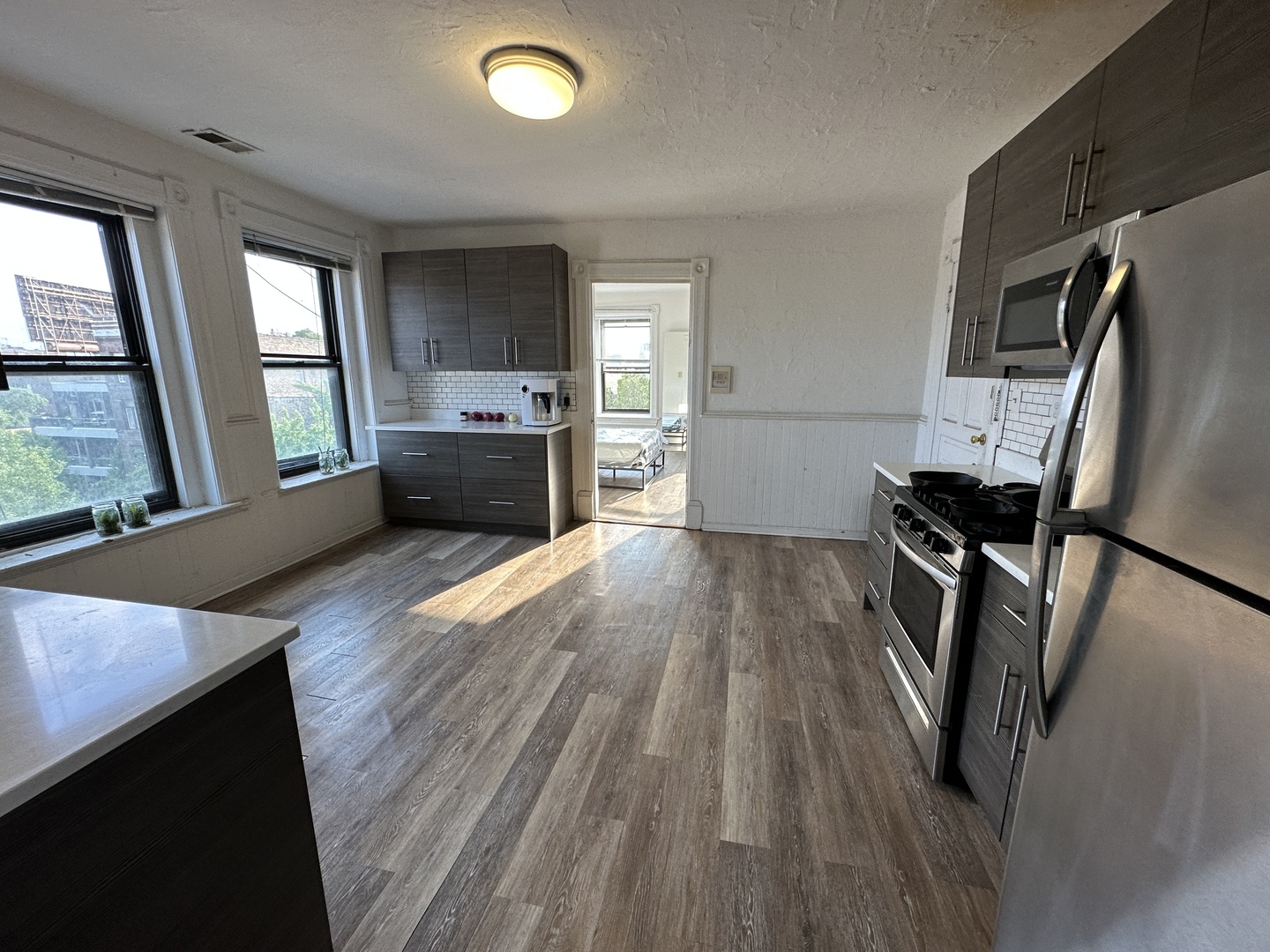 1237 North Noble Street, Unit 4 Chicago, IL 60642 - Photo 20 of 27 a living room with furniture and a flat screen tv
