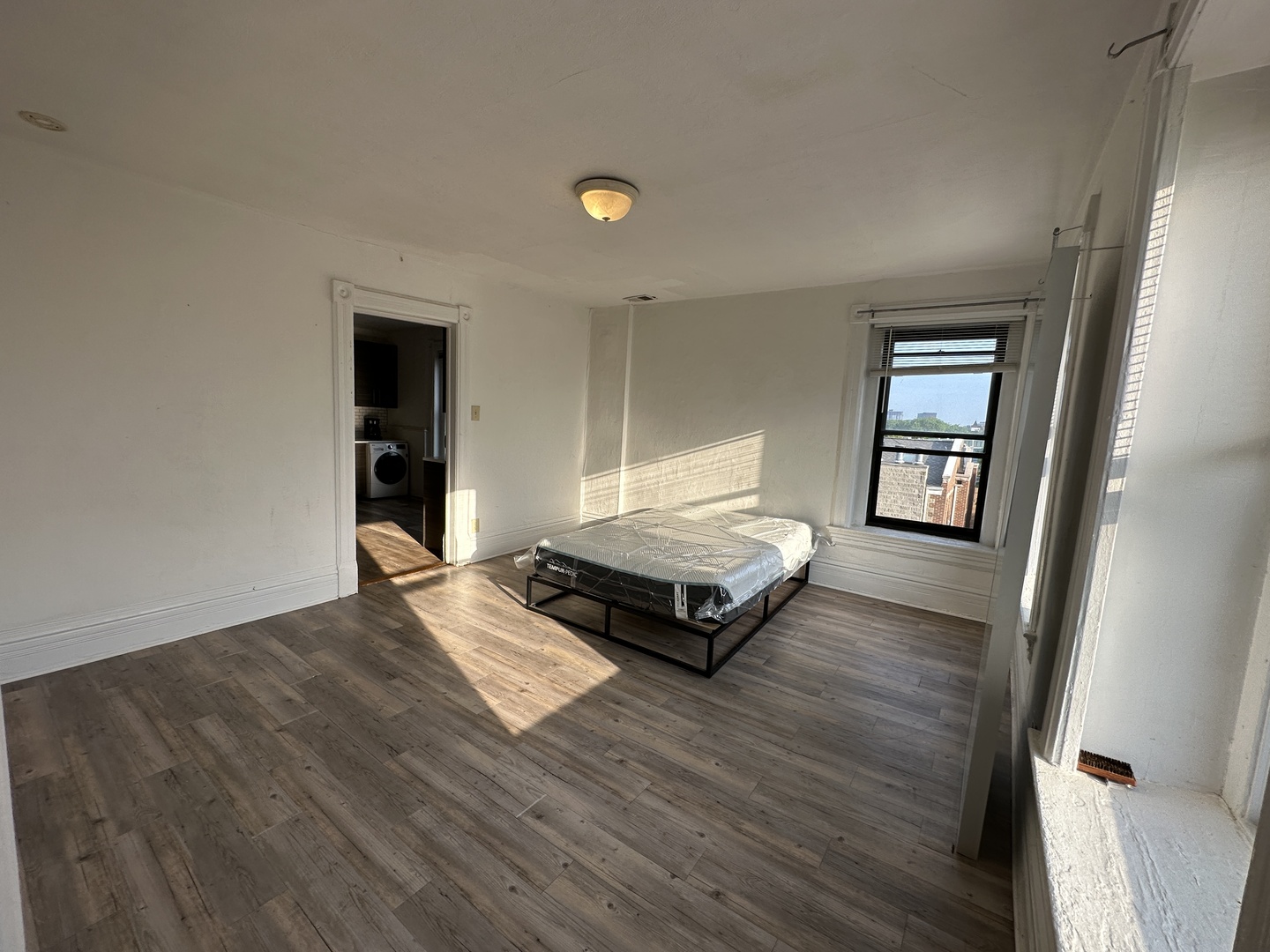 1237 North Noble Street, Unit 4 Chicago, IL 60642 - Photo 24 of 27 wooden floor with view of a living room