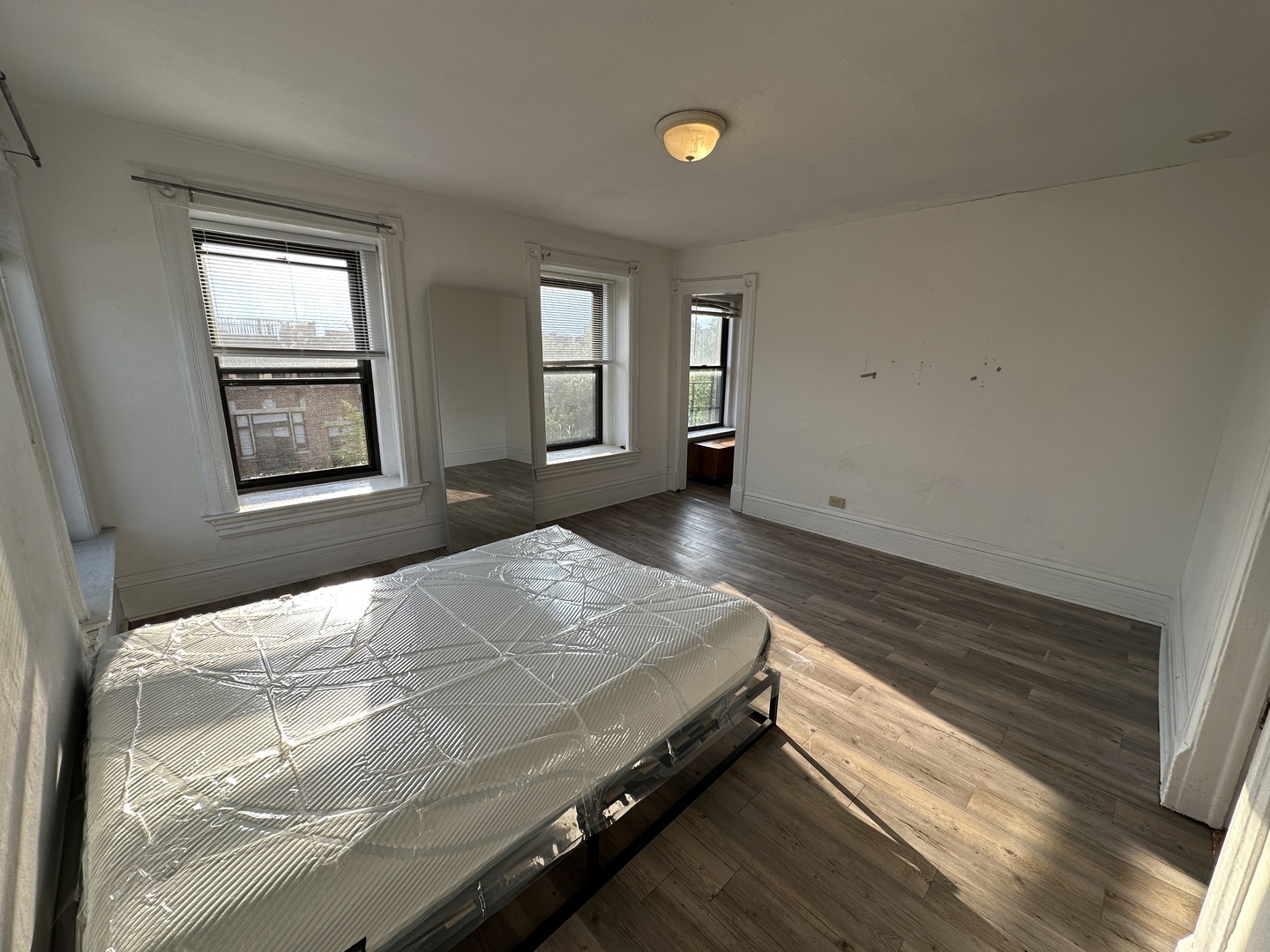 1237 North Noble Street, Unit 4 Chicago, IL 60642 - Photo 25 of 27 a bedroom with a bed and a window