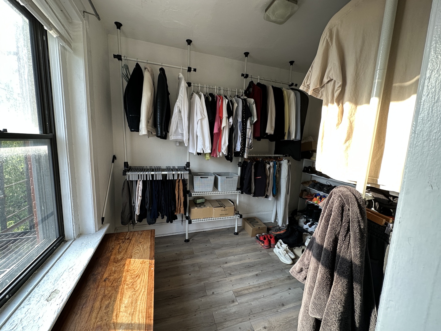 1237 North Noble Street, Unit 4 Chicago, IL 60642 - Photo 26 of 27 a view of walk in closet with clothes and shoes