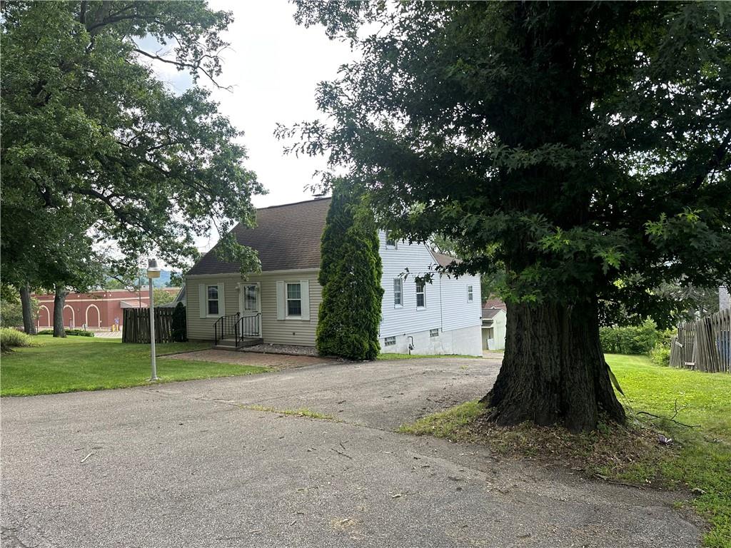 3323 Leechburg Road Lower Burrell, PA 15068 - Photo 11 of 42 a view of a house with a tree in front of it