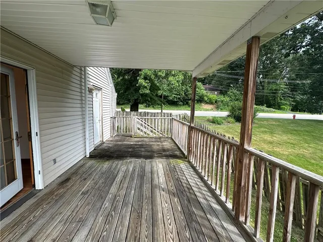 a view of deck with wooden floor and outdoor seating