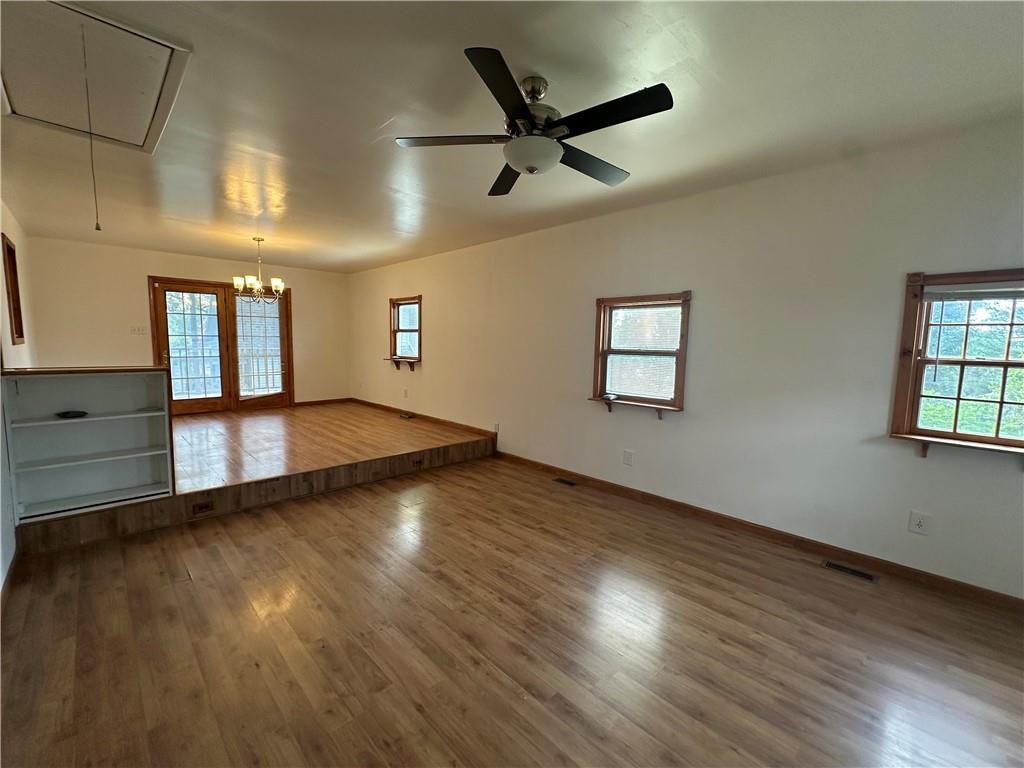 3323 Leechburg Road Lower Burrell, PA 15068 - Photo 14 of 42 an empty room with wooden floor and windows