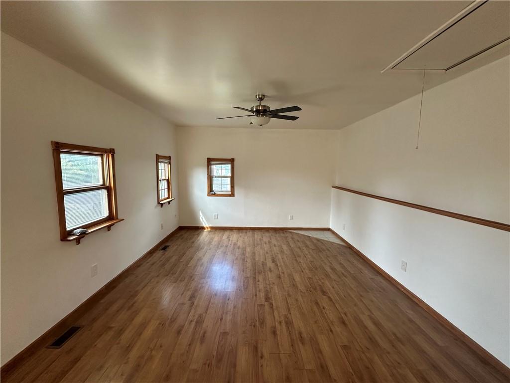 3323 Leechburg Road Lower Burrell, PA 15068 - Photo 17 of 42 a view of a livingroom with wooden floor and a ceiling fan