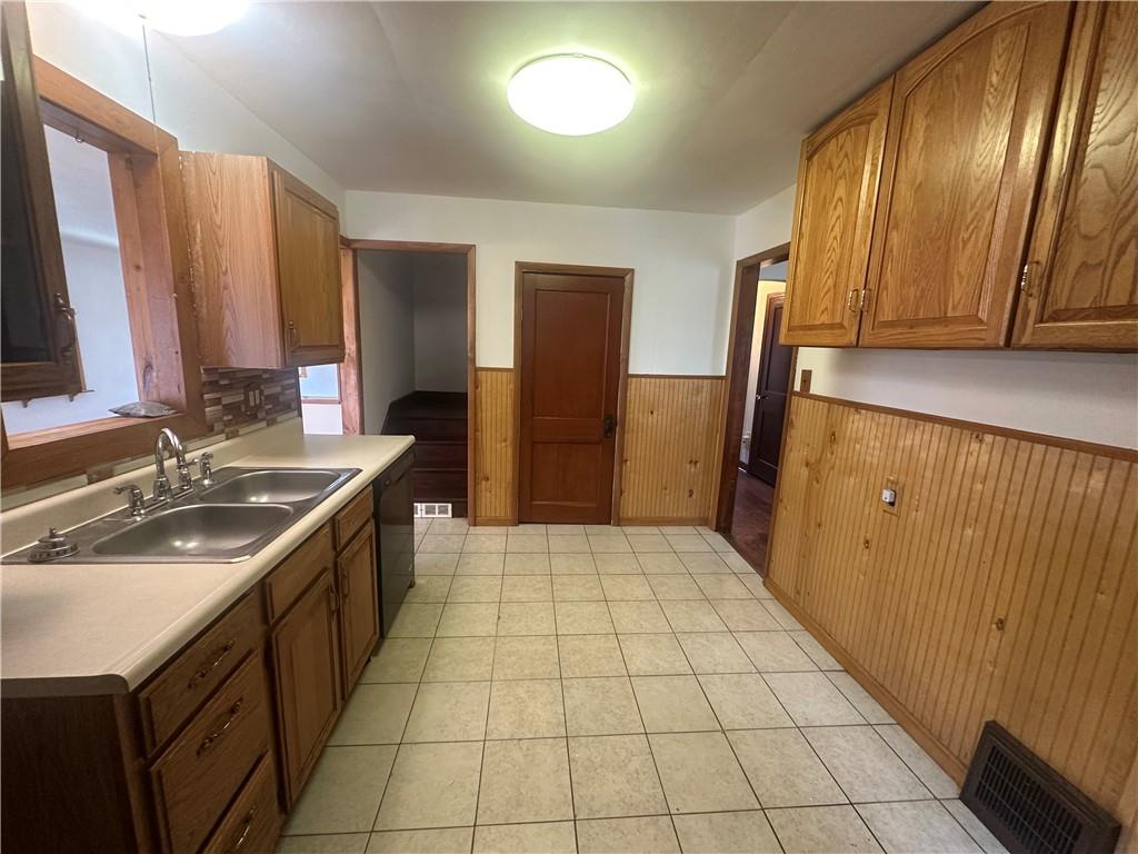 3323 Leechburg Road Lower Burrell, PA 15068 - Photo 20 of 42 a bathroom with a sink a toilet and a mirror