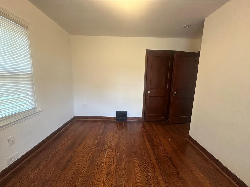 3323 Leechburg Road Lower Burrell, PA 15068 - Photo 21 of 42 an empty room with wooden floor and windows