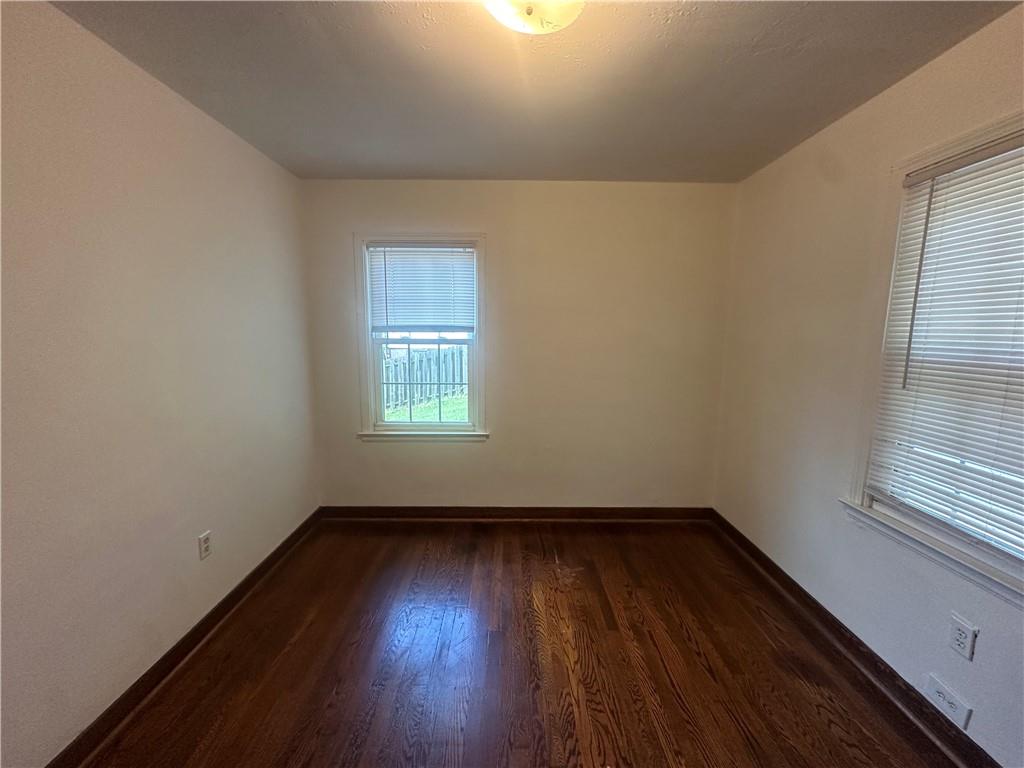 3323 Leechburg Road Lower Burrell, PA 15068 - Photo 22 of 42 an empty room with wooden floor and windows