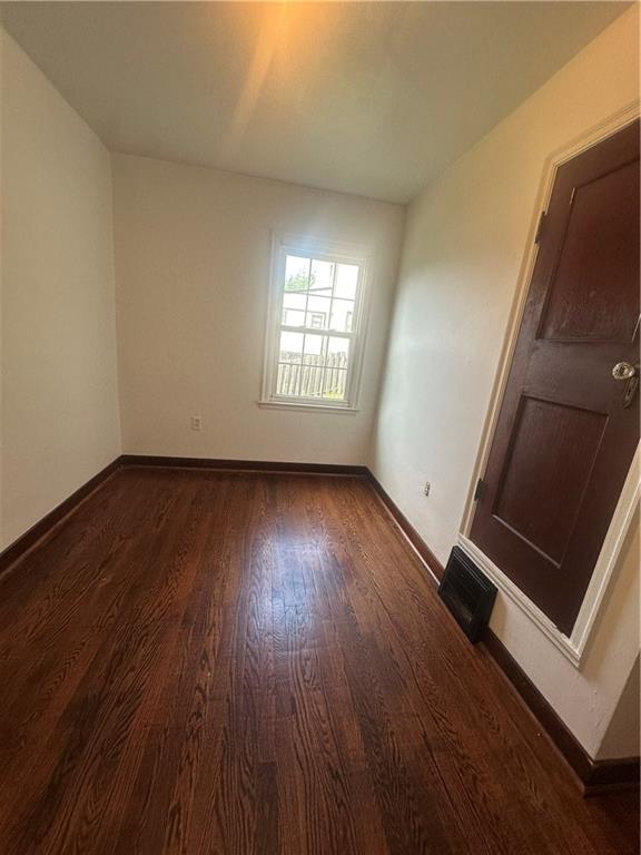 3323 Leechburg Road Lower Burrell, PA 15068 - Photo 29 of 42 an empty room with wooden floor and windows