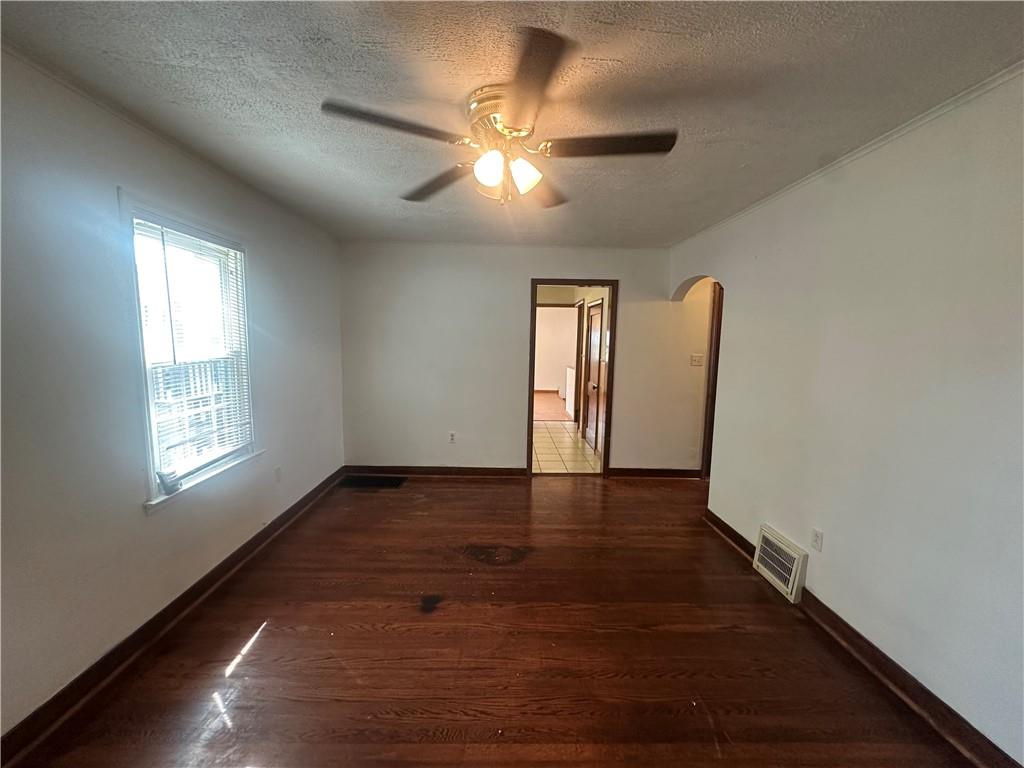 3323 Leechburg Road Lower Burrell, PA 15068 - Photo 30 of 42 a view of an empty room with wooden floor and a window