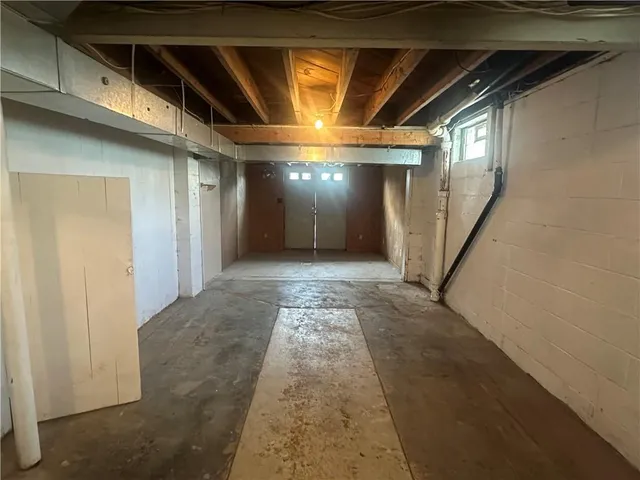 a view of a garden with a bench in the garden