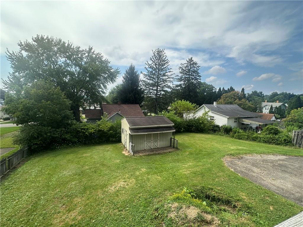 3323 Leechburg Road Lower Burrell, PA 15068 - Photo 38 of 42 a view of a garden with a bench in the garden