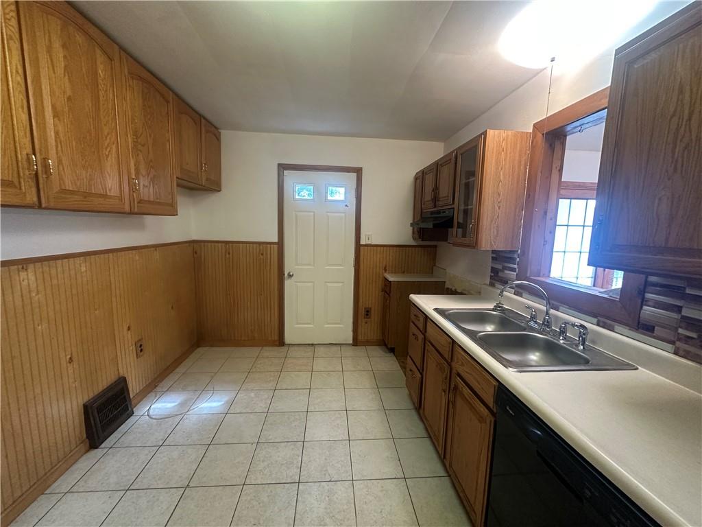 3323 Leechburg Road Lower Burrell, PA 15068 - Photo 42 of 42 a kitchen with a sink stove and cabinets