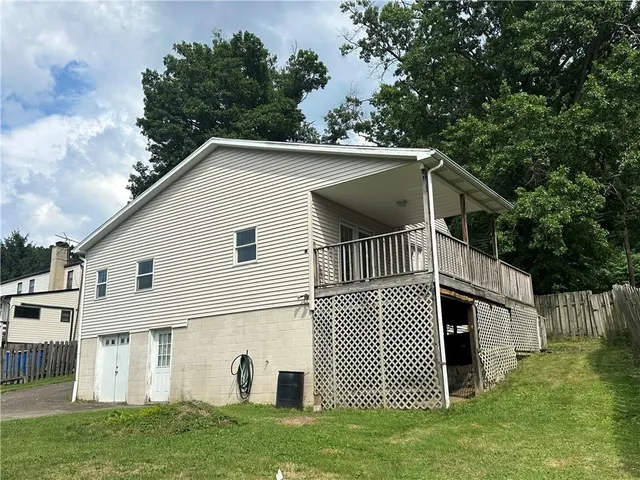 a view of a backyard of the house
