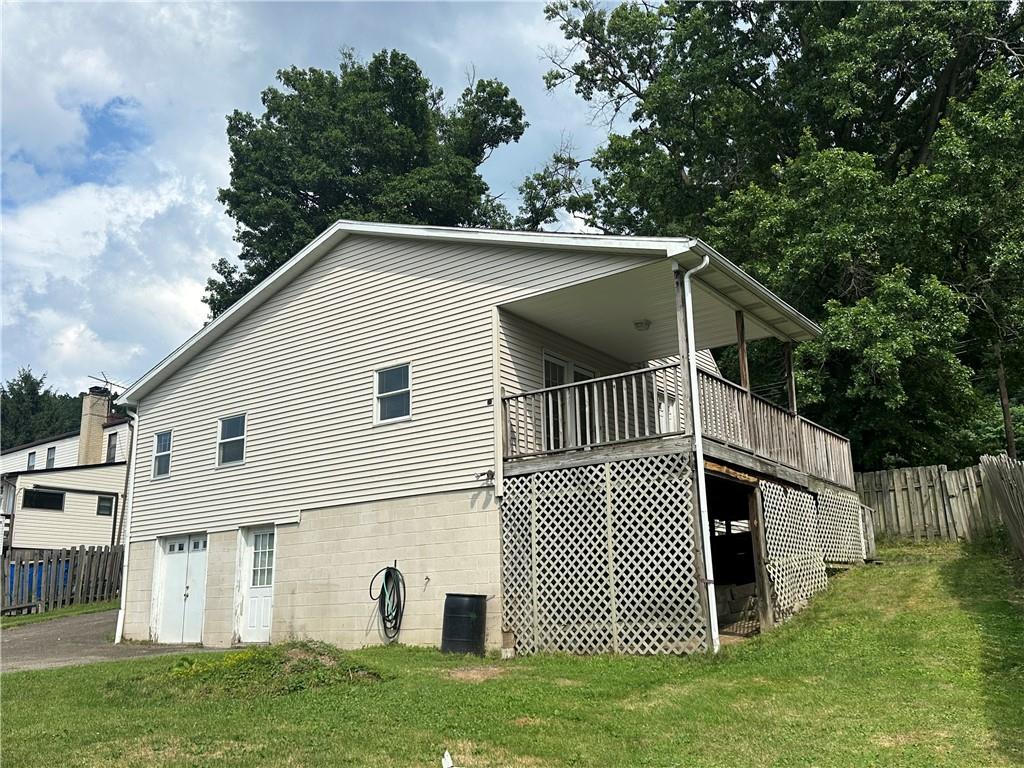 3323 Leechburg Road Lower Burrell, PA 15068 - Photo 7 of 42 a view of a white house with a yard and deck