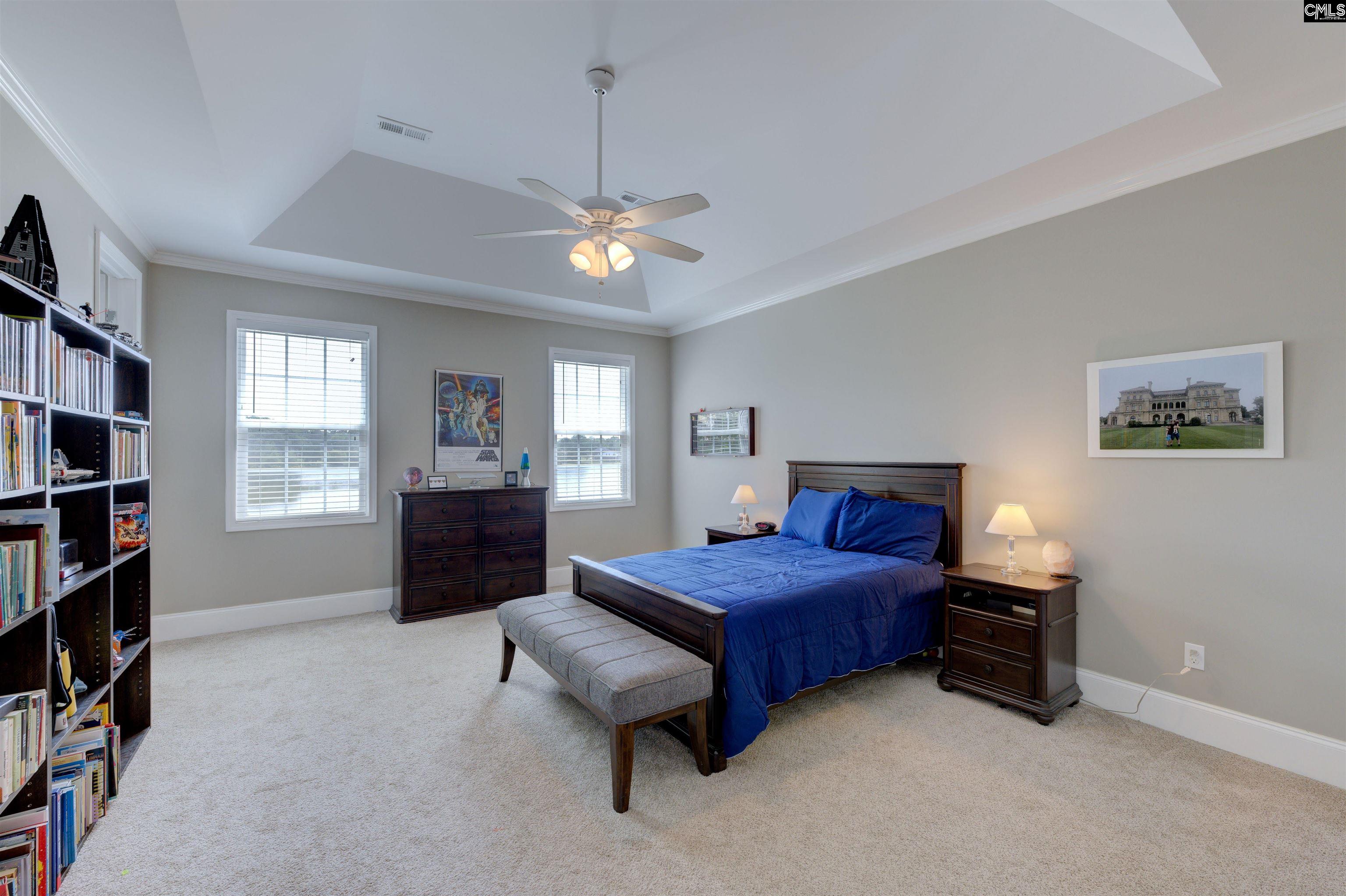 305 Northlake Road Columbia, SC 29223 - Photo 34 of 46 a bedroom with a bed furniture a chandelier and closet