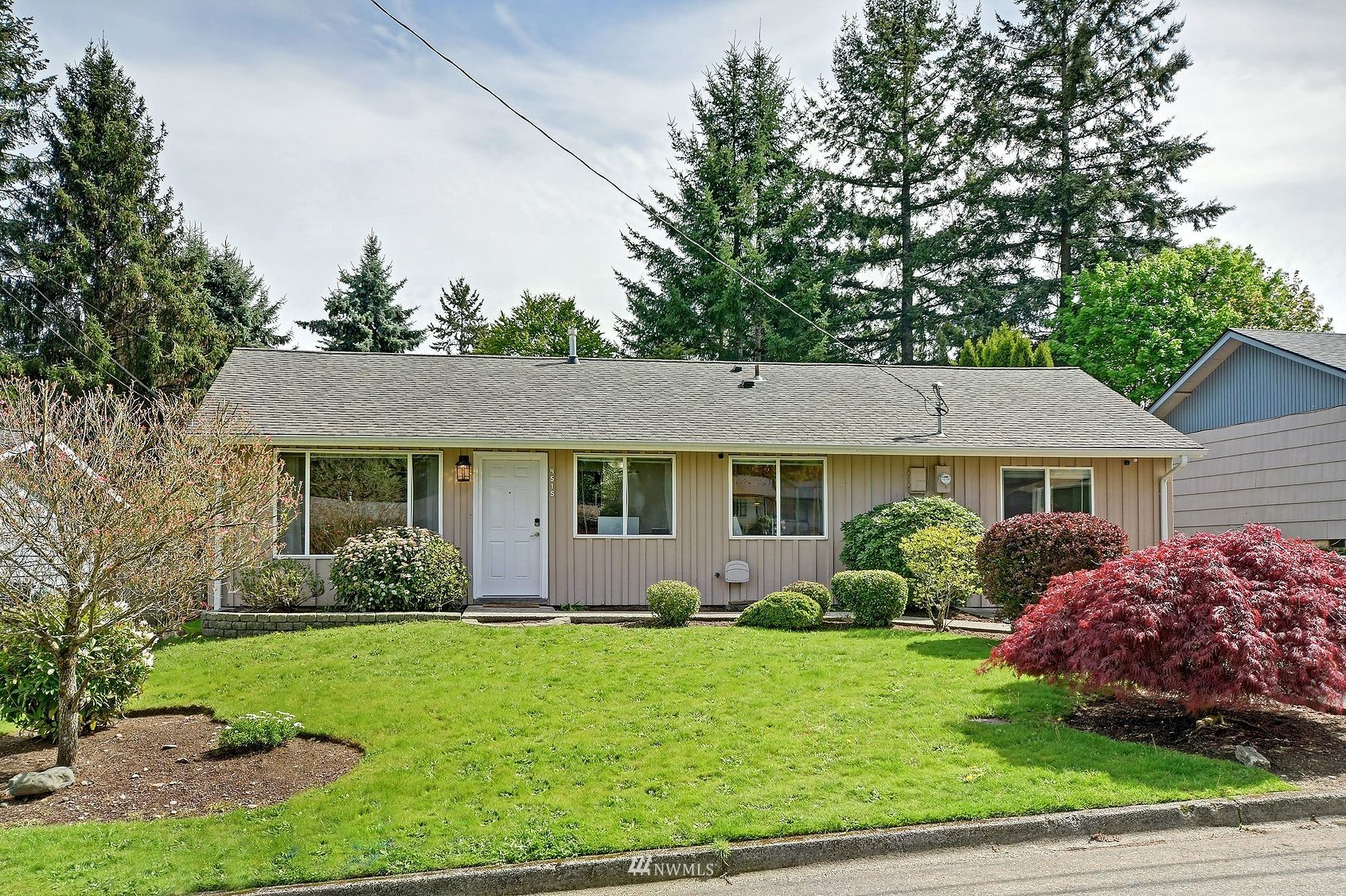 4515 Southeast 3rd Place Renton, WA 98059 - Photo 1 of 18 a front view of a house with garden