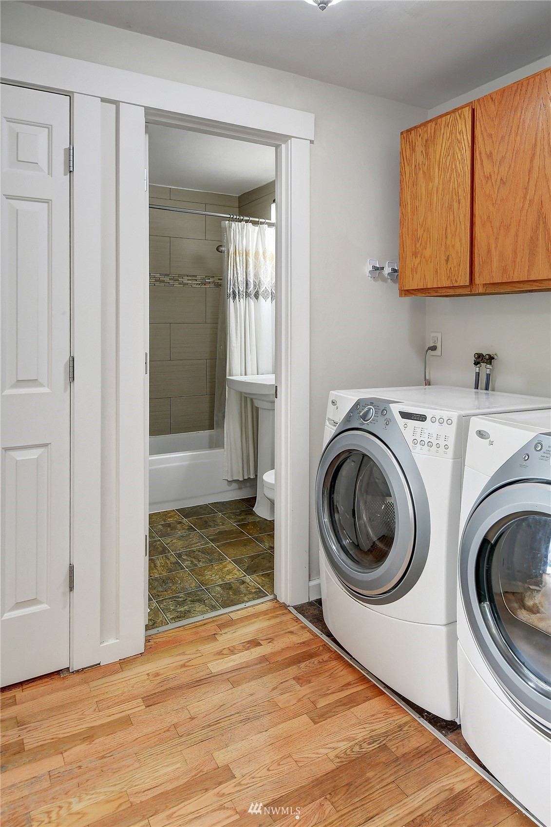 4515 Southeast 3rd Place Renton, WA 98059 - Photo 12 of 18 a view of a hallway with washer and dryer