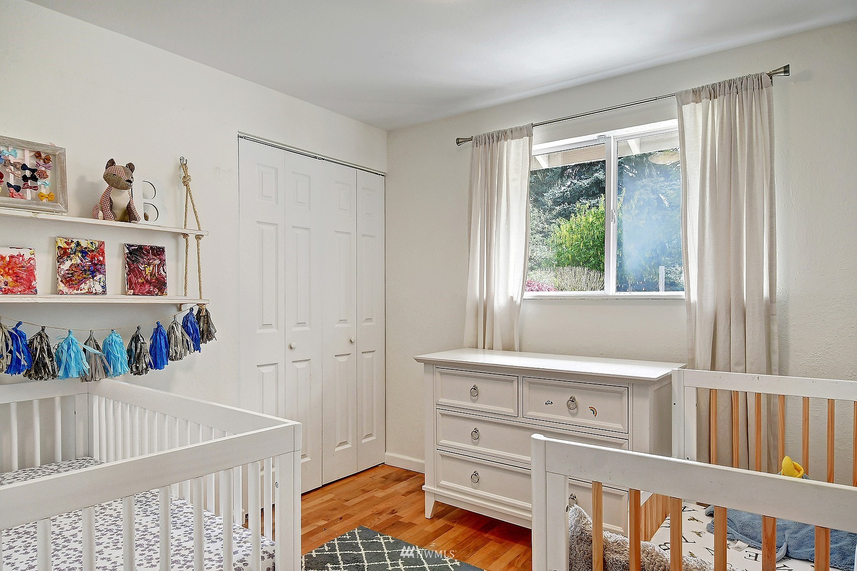 4515 Southeast 3rd Place Renton, WA 98059 - Photo 13 of 18 a bedroom with furniture and a window
