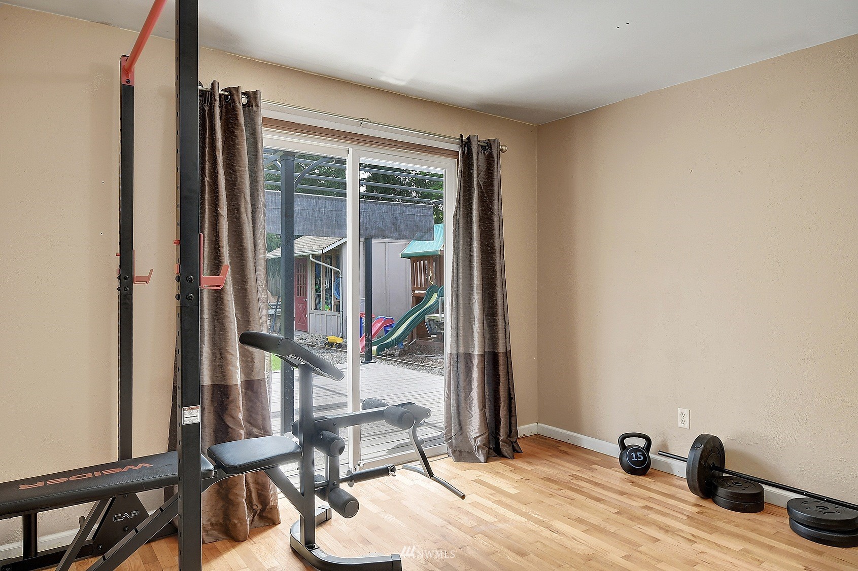 4515 Southeast 3rd Place Renton, WA 98059 - Photo 14 of 18 a view of an empty room and wooden floor
